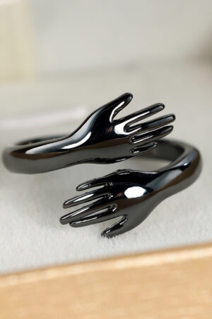 Couples Rings With Palms Spread Wide